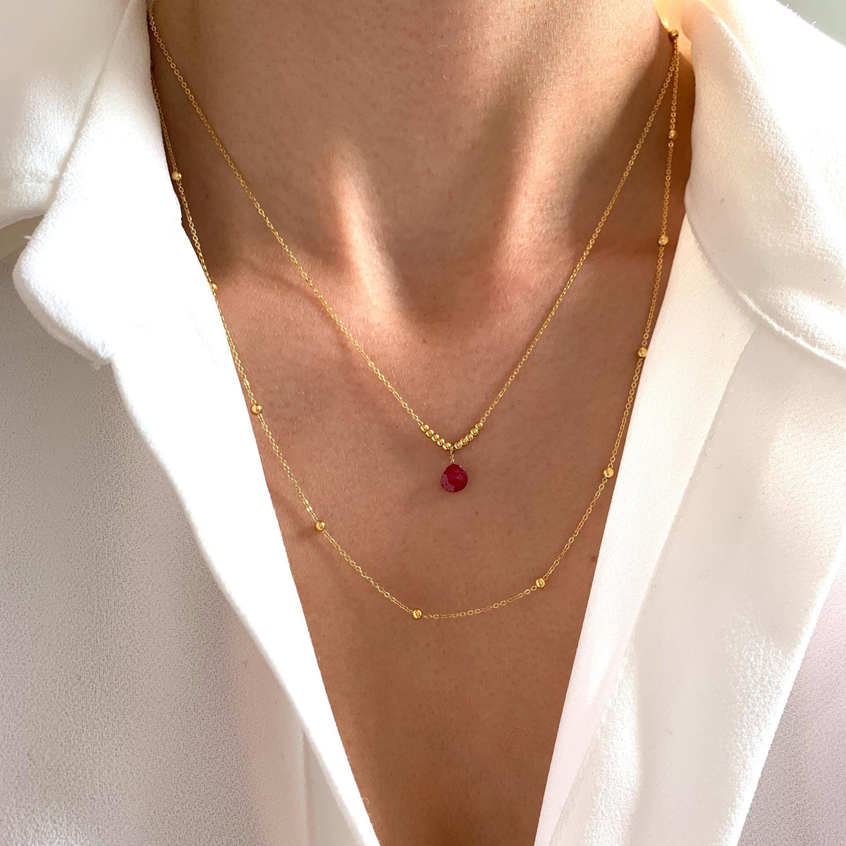 Collier double rang goutte grenat Capucine